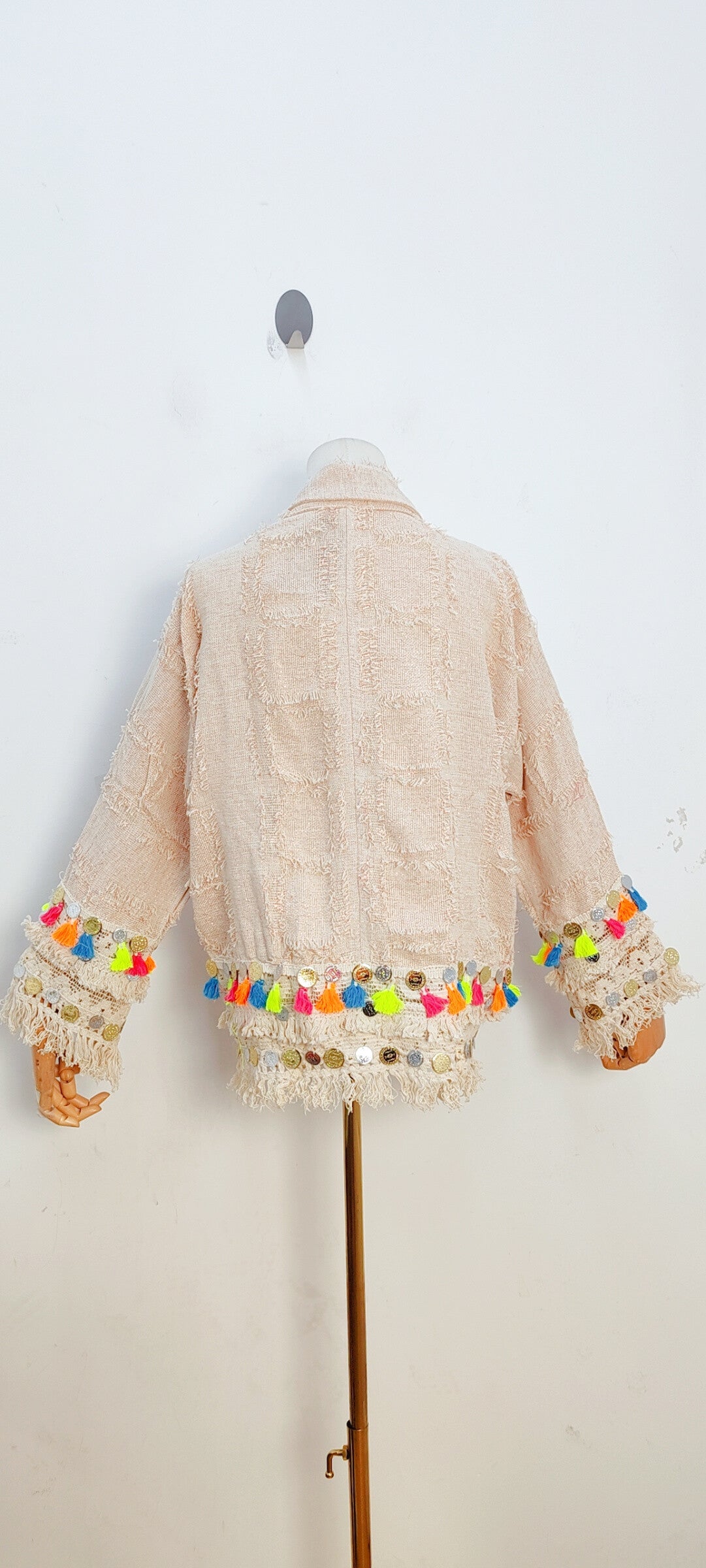 Light colored tassel jacket