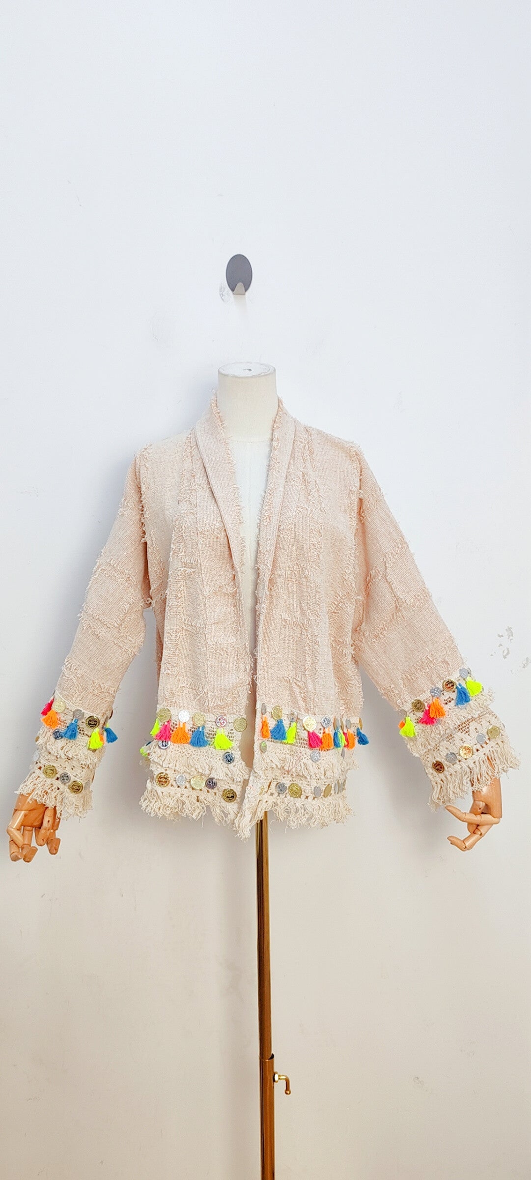 Light colored tassel jacket