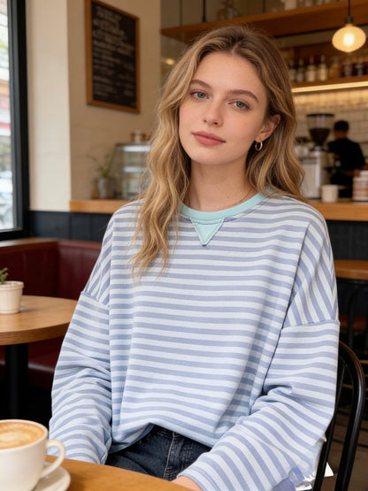 Blue toned stripe oversized sweatshirt on trend cool style for spring 
