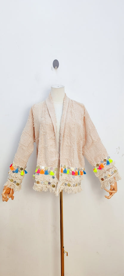 Light colored tassel jacket