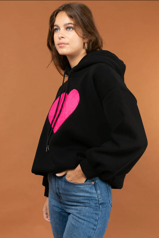 Black soft hoody pop of pink in a heart motife